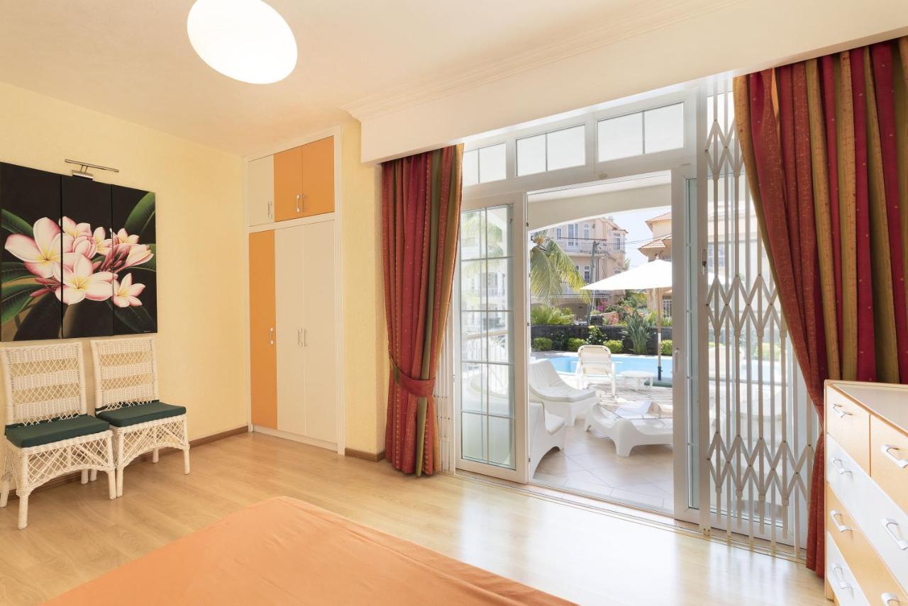 Apartment Orchid Гранд Байе Екстериор снимка